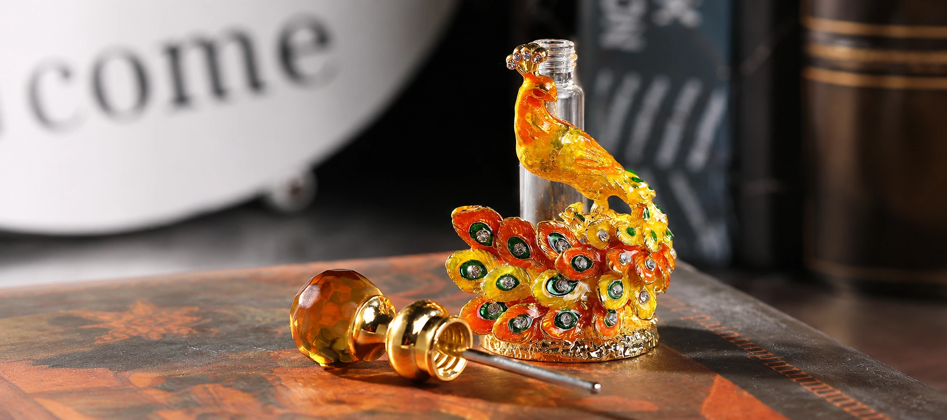 ornate peacock perfume bottle accessory gem stopper closeup