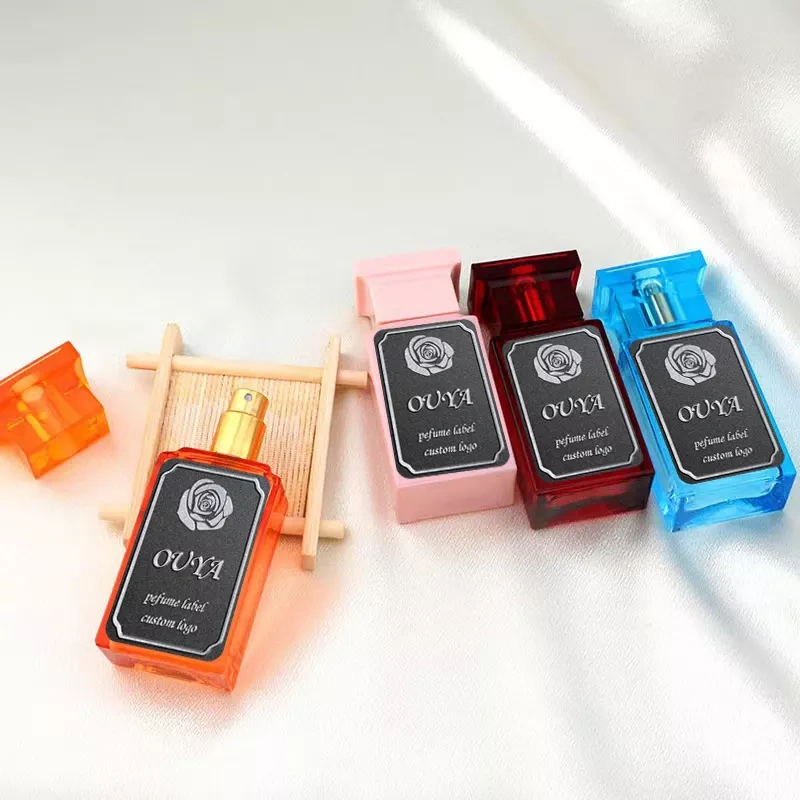 rose scrub metal label perfume bottle closeup square