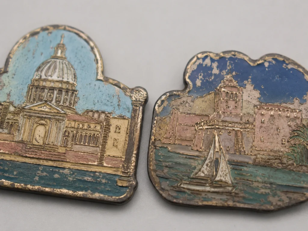 worn metal enamel fridge magnets fading tarnish close up