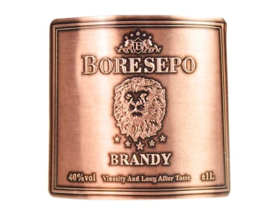 lion embossed antique copper brandy bottle tag front view