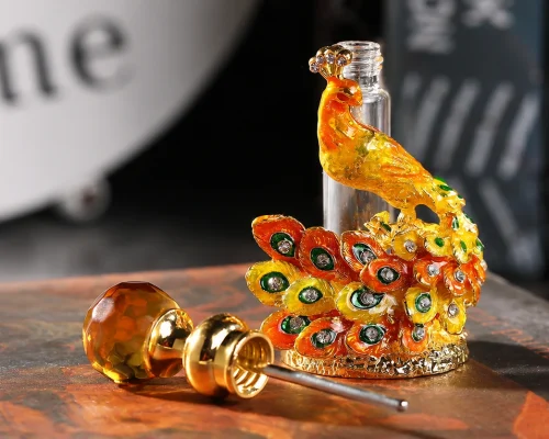 ornate peacock perfume bottle accessory gem stopper closeup